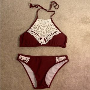 Maroon bikini with lace accents.